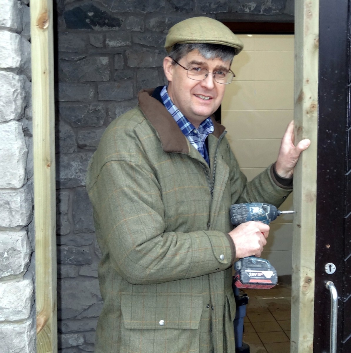 Chain reaction: Michael Holgate at work on Silverdale park's new toilet block which will also be twinned with loos overseas