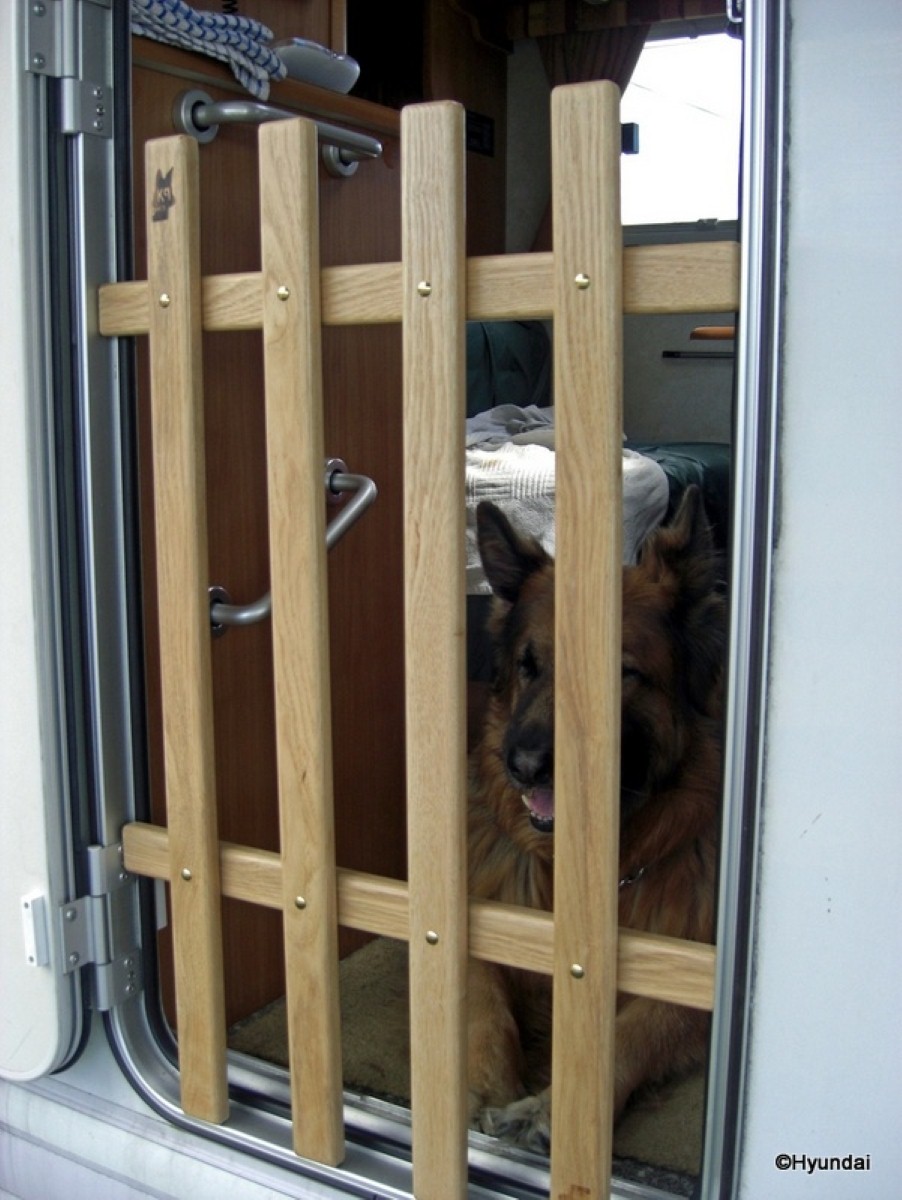 The K9 Gate in action, the solution to containing lively dogs on caravan holidays