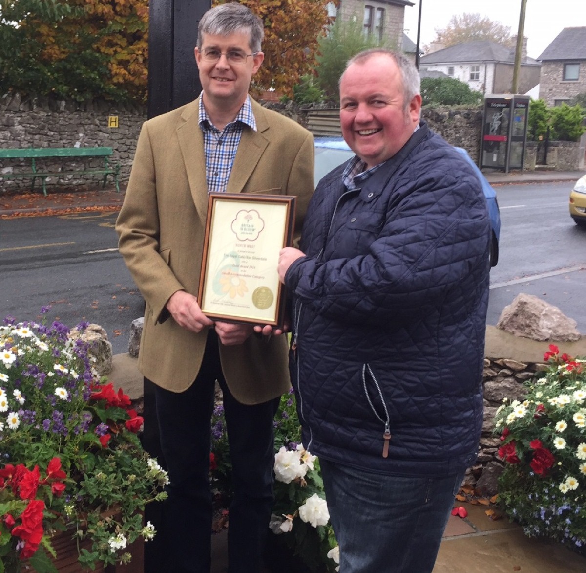 Michael Holgate (left) is congratulated at The Royal by North West in Bloom judge and BBC local radio presenter Stephen Lowe.