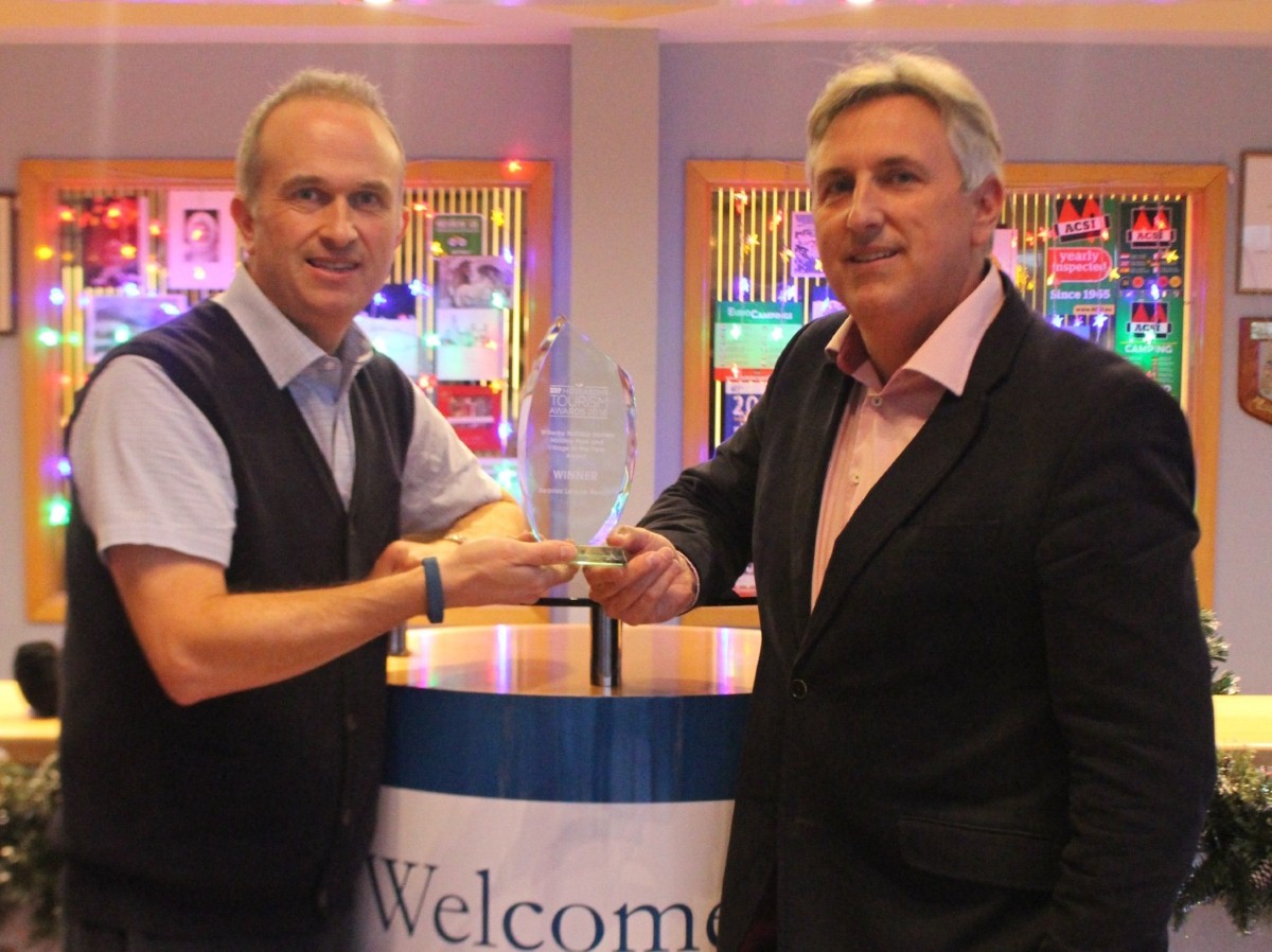 Brothers Andrew (left) and Paul Searle with the trophy celebrating their park's victory in the tourism awards