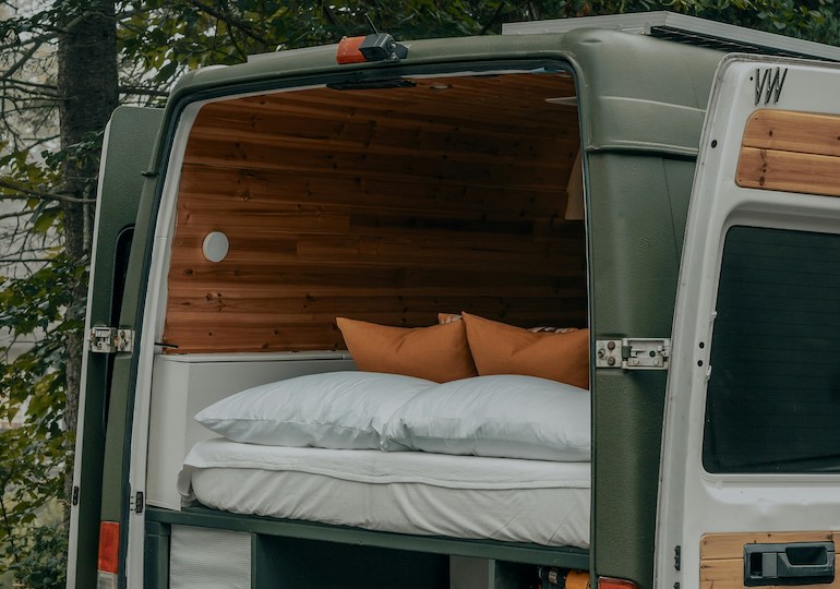A bed in the back of a motorhome