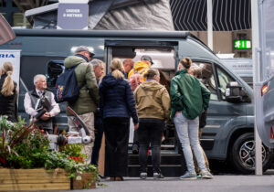 Attendees look around a motorhome